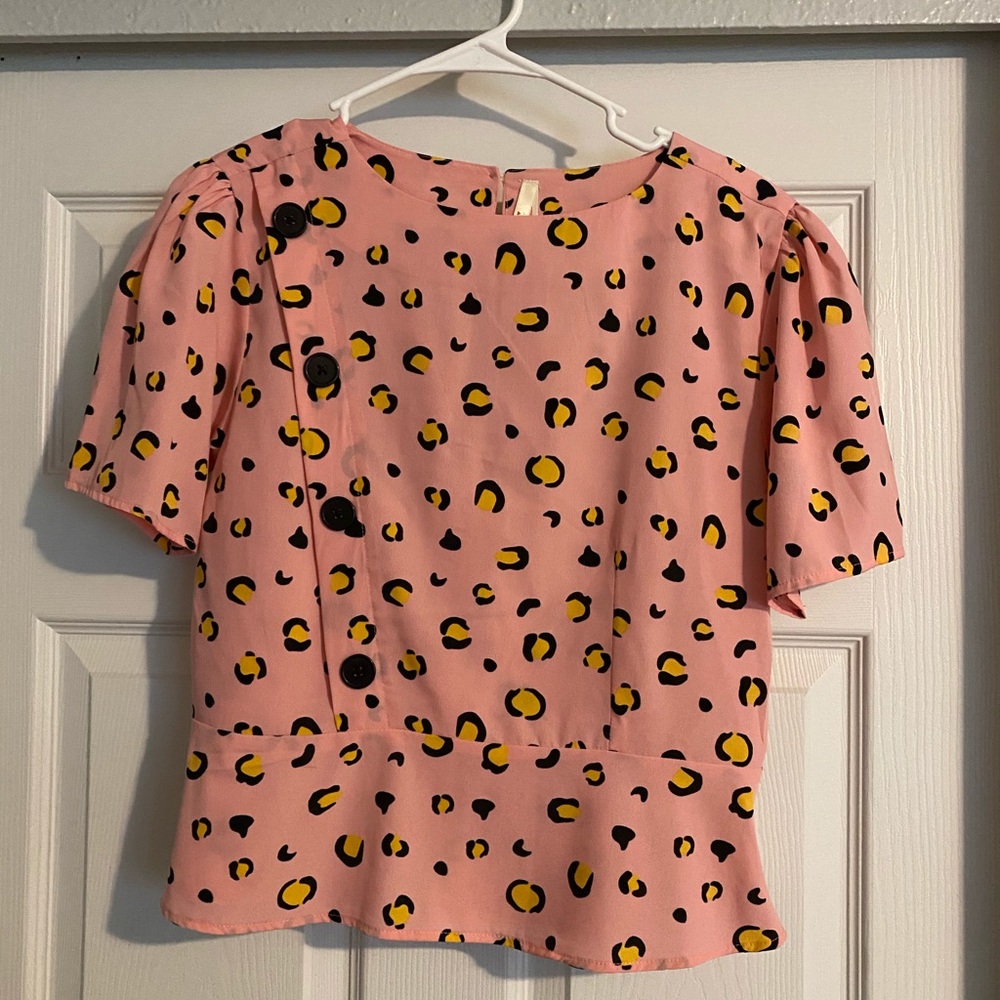 Peplum style leopard top
